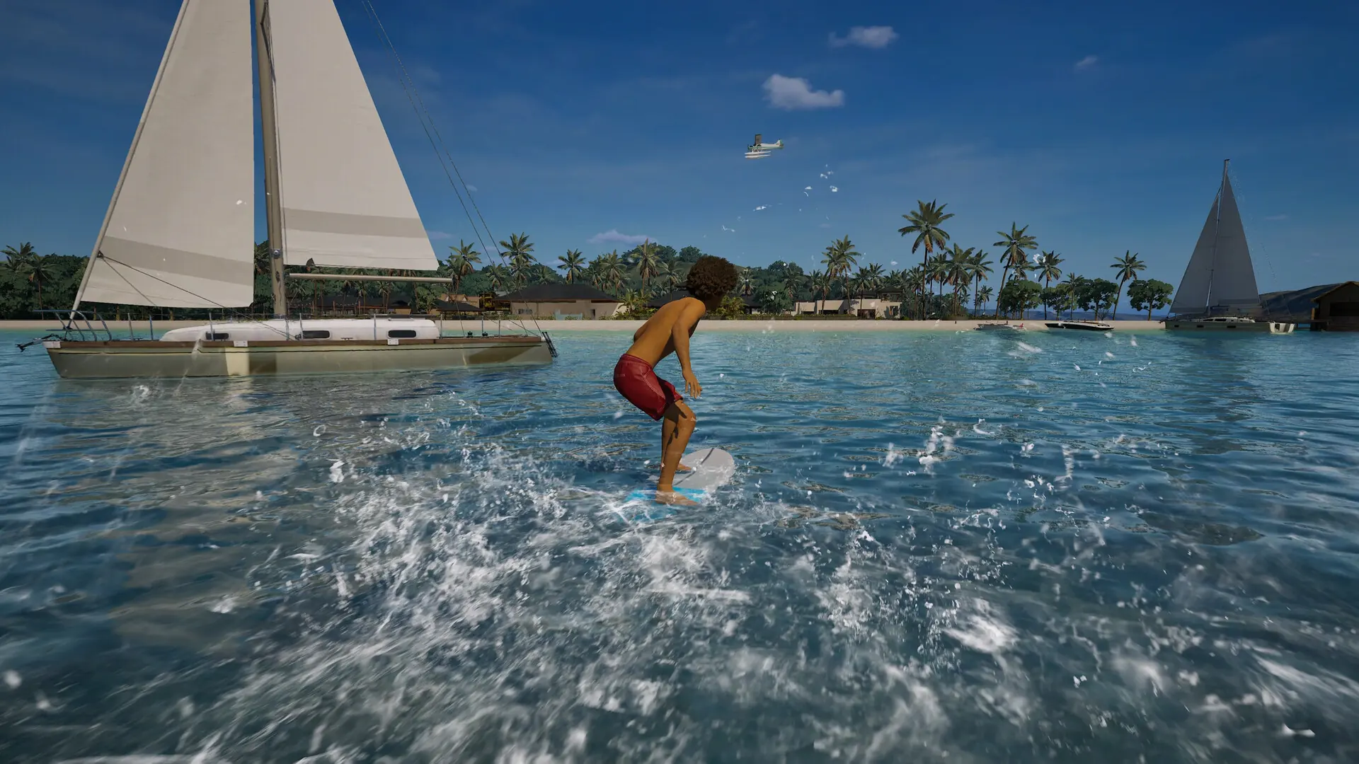 A Zoi surfing near sailboats, on a tropical beach